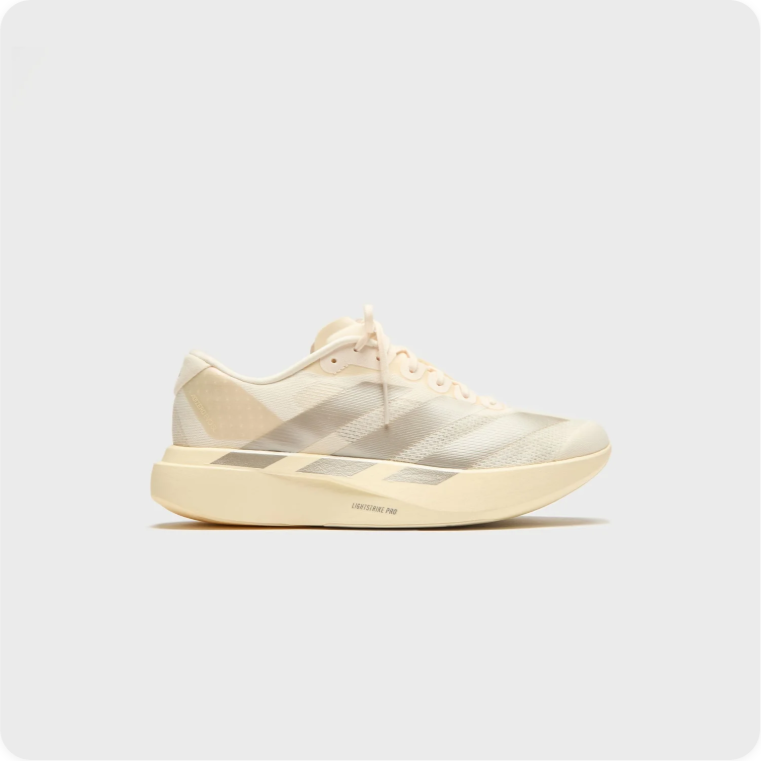 Adidas Adizero Takumi Sen 10 Cream Silver - side profile view showing translucent midsole windows and slim racing silhouette