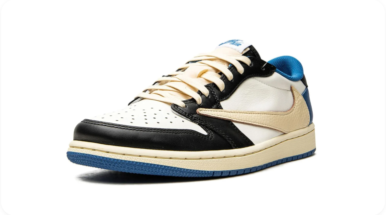 Travis Scott x Fragment x Air Jordan 1 Low OG - front three-quarter view showing sail leather, Fragment lightning bolt and blue collar