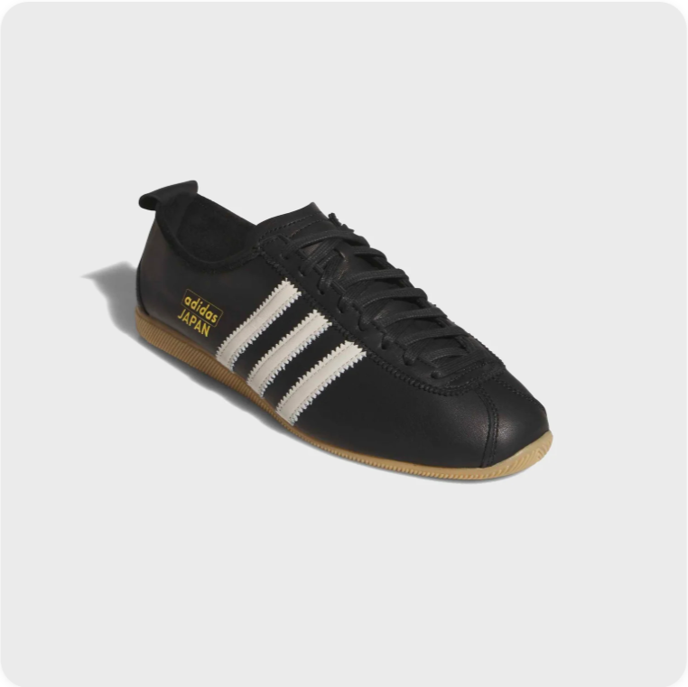 Adidas Japan Black Leather - three-quarter front view showing gold JAPAN branding